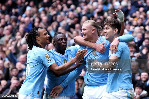 Erling Haaland of Manchester City celebrates with team mates after scoring his team's first goal during the Premier League match between Manchester...