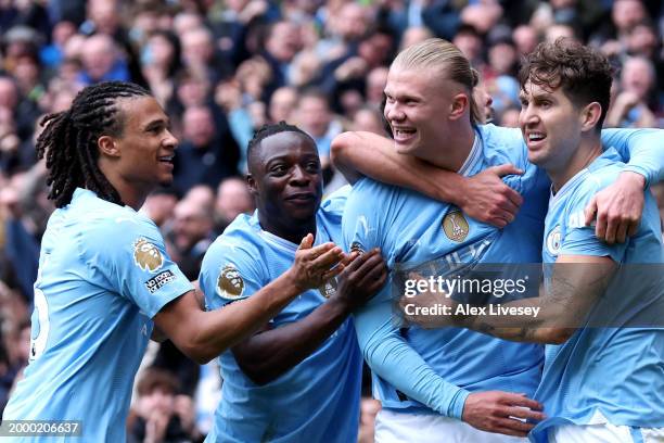 Erling Haaland of Manchester City celebrates with team mates after scoring his team's first goal during the Premier League match between Manchester...