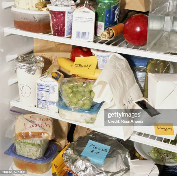 refrigerator shelves filled with food - fridge full of food stockfoto's en -beelden