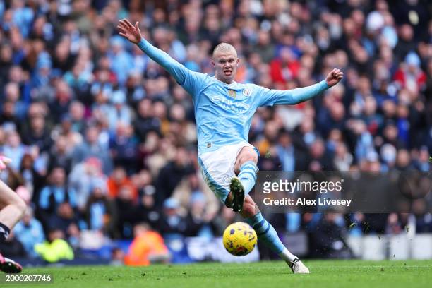 Erling Haaland of Manchester City scores his team's second goal during the Premier League match between Manchester City and Everton FC at Etihad...