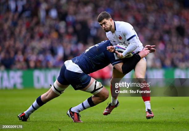 Matthieu Jalibert of France is tackled by Grant Gilchrist of Scotland during the Guinness Six Nations 2024 match between Scotland and France at BT...