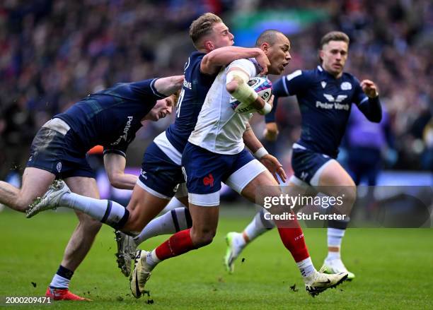 Gael Fickou of France is challenged by Duhan van der Merwe of Scotland during the Guinness Six Nations 2024 match between Scotland and France at BT...