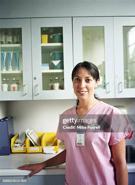 hospital nurse in supply room - security badge stock pictures, royalty-free photos & images