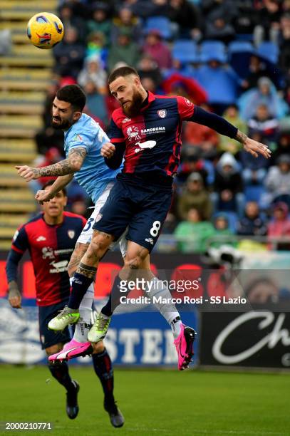 Elseid Hysaj of SS Lazio compete for the ball with Nandez of Cagliari during the Serie A TIM match between Cagliari and SS Lazio at Sardegna Arena on...