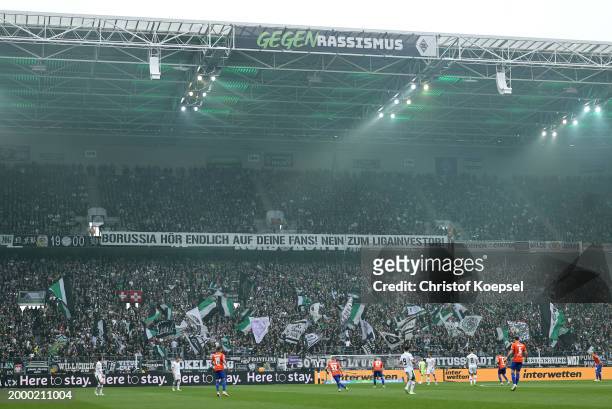 Borussia Mönchengladbach fans hold up a banner in protest of investors during the Bundesliga match between Borussia Mönchengladbach and SV Darmstadt...