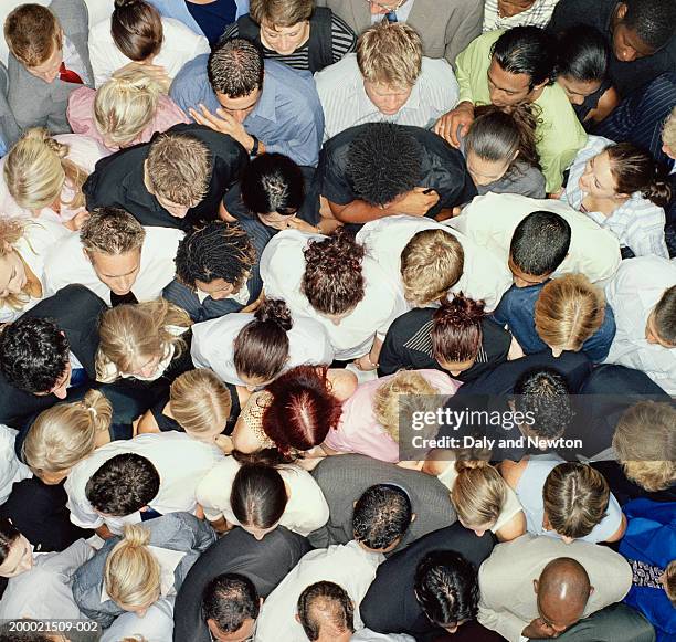 crowd of people huddled together, overhead view - population explosion stock pictures, royalty-free photos & images