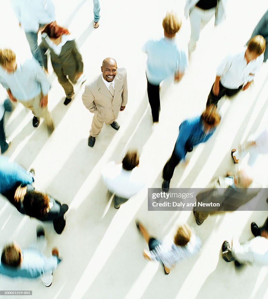 People walking (focus on man looking up), portrait, elevated view