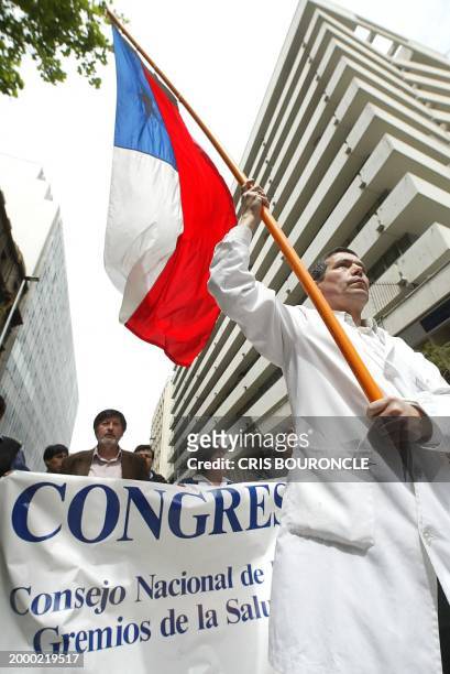 Chileans belonging to the Colegio Medico and health union, march through a street in Santiago, 08 October 2002, in demonstration to the new...