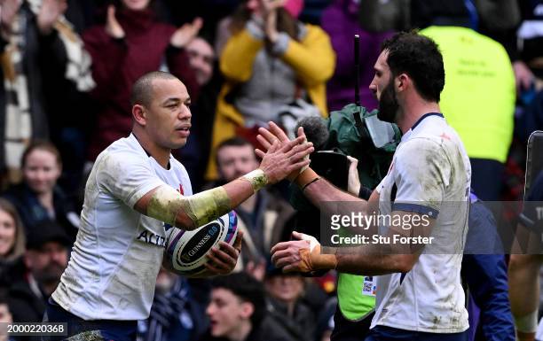 Gael Fickou of France celebrates scoring his team's first try with teammate Charles Ollivon during the Guinness Six Nations 2024 match between...