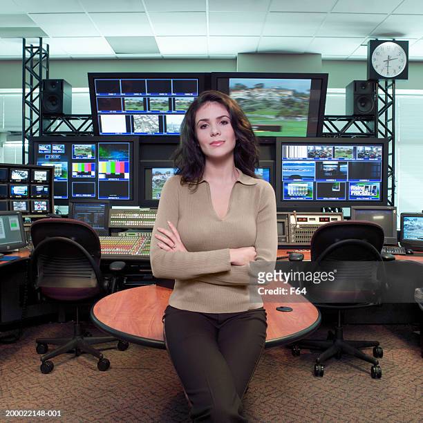 professional woman standing in television studio control room - broadcast control room stock pictures, royalty-free photos & images