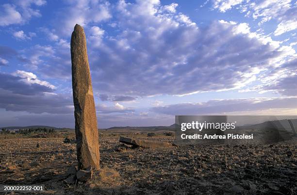 ethiopia, axum, stelae field under cloudy sky - axum stock pictures, royalty-free photos & images