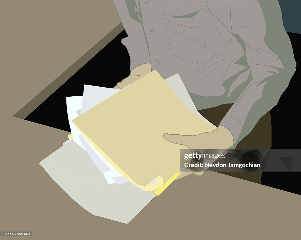 Businessman holding stack of paperwork and files, mid section