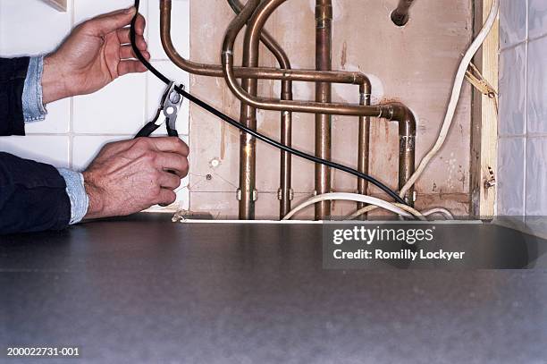 electrician stripping wire, close-up - draadtang stockfoto's en -beelden