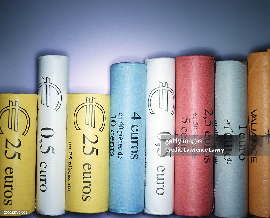 European currency: various denominations of coins wrapped in paper