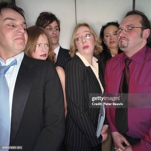 group of business people in lift, close-up - stuck inside fotografías e imágenes de stock