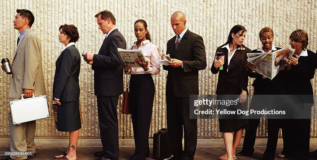 Group of businesspeople waiting in line