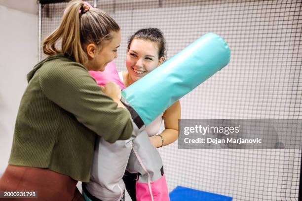 female friends having fun in indoor playground - playground balance beam stock pictures, royalty-free photos & images