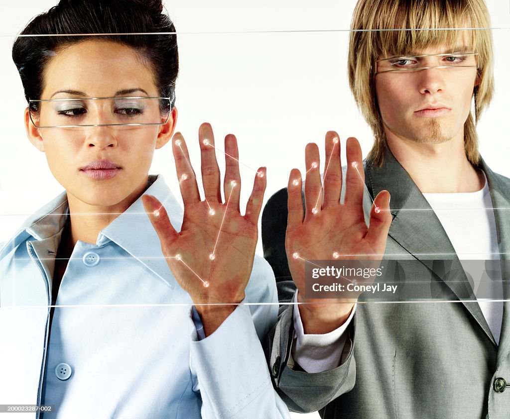 Young woman and man, connecting points of light on palms