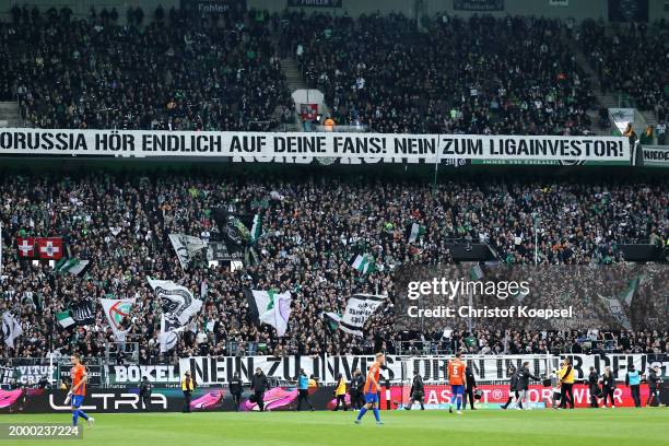 Fans protest against investors of the DFL with banners and tennis balls during the Bundesliga match between Borussia Mönchengladbach and SV Darmstadt...