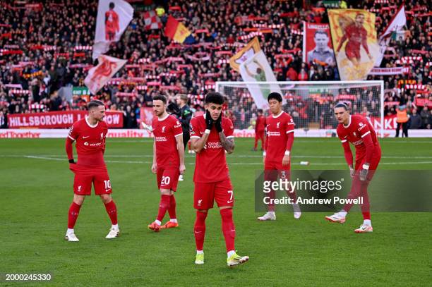 Liverpool players in front of the Kop stand before the Premier League match between Liverpool FC and Burnley FC at Anfield on February 10, 2024 in...