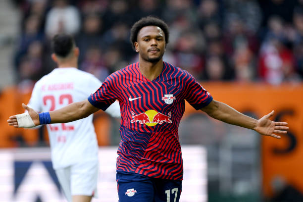 Lois Openda of RB Leipzig celebrates scoring his team's first goal during the Bundesliga match between FC Augsburg and RB Leipzig at WWK-Arena on...