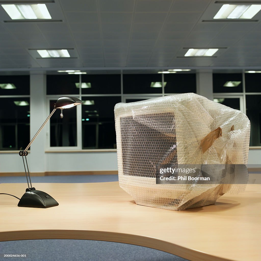 Wrapped Monitor Angle Poise Lamp Shining By Computer Monitor Wrapped In Bubble Wrap ...