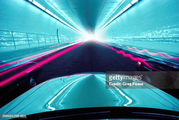 cars driving through tunnel (long exposure, digital enhancement) - digitaal bewerkt stockfoto's en -beelden