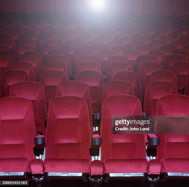 red stadium theater seats - empty seat stock pictures, royalty-free photos & images