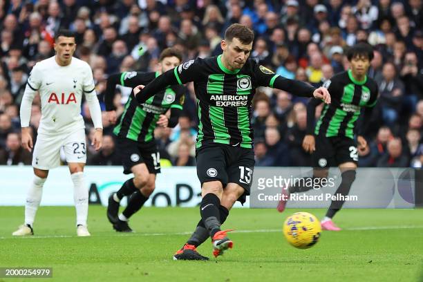 Pascal Gross of Brighton & Hove Albion scores his team's first goal from the penalty spot during the Premier League match between Tottenham Hotspur...
