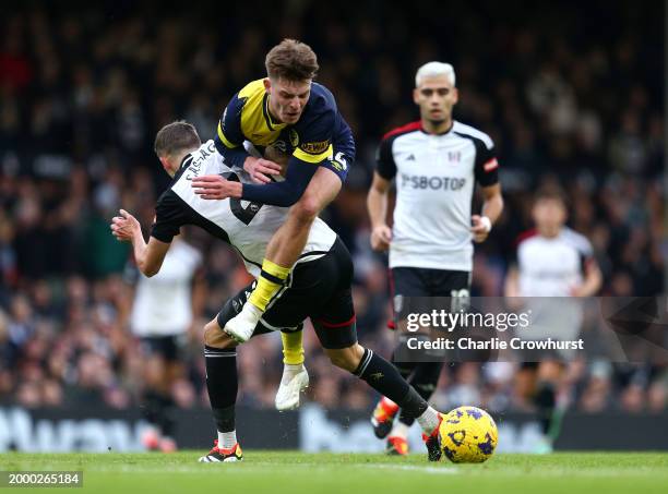 Alex Scott of AFC Bournemouth is challenged by Timothy Castagne of Fulham during the Premier League match between Fulham FC and AFC Bournemouth at...