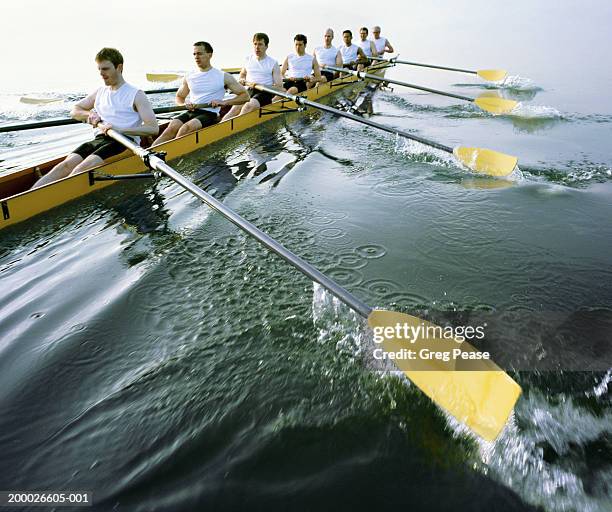 eight man rowing team practicing (digital enhancement) - remo de competición fotografías e imágenes de stock