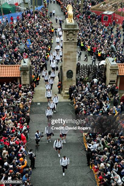 Jamie George of England leads players of England into the stadium, as they walk through the The Rowland Hill Memorial Gates, prior to the Guinness...