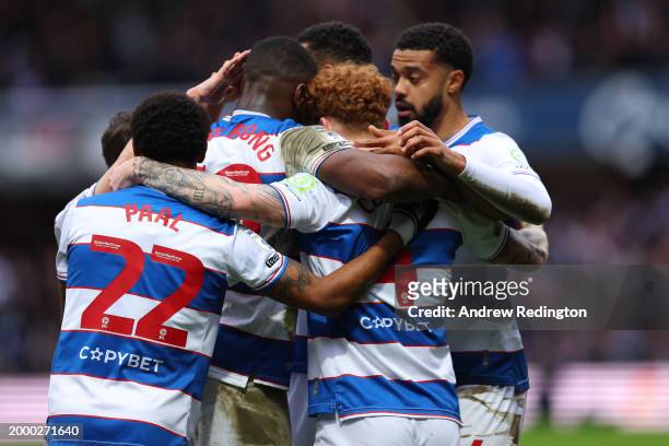 Queens Park Rangers players celebrate after Jack Colback scored his side's opening goal during the Sky Bet Championship match between Queens Park...