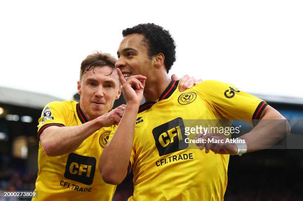 Cameron Archer of Sheffield United celebrates scoring his team's first goal with teammate Ben Osborn of Sheffield United during the Premier League...