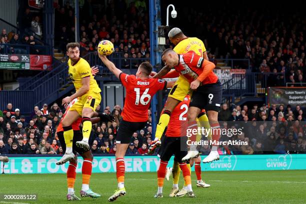 Reece Burke of Luton Town gives away a penalty after a handball during the Premier League match between Luton Town and Sheffield United at Kenilworth...