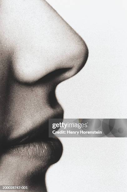 young man, close-up, profile (grainy, b&w) - human nose stockfoto's en -beelden
