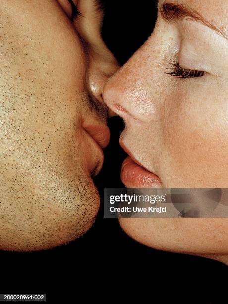 couple preparing to kiss, close-up - black women kissing white men stock pictures, royalty-free photos & images