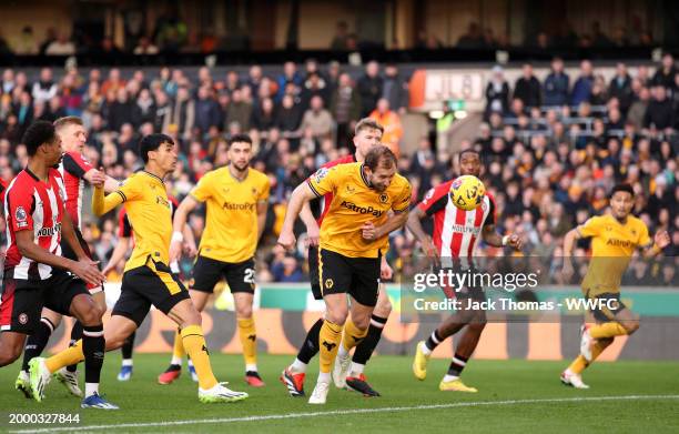 Craig Dawson of Wolverhampton Wanderers scores their sides goal which is later ruled offside by VAR during the Premier League match between...