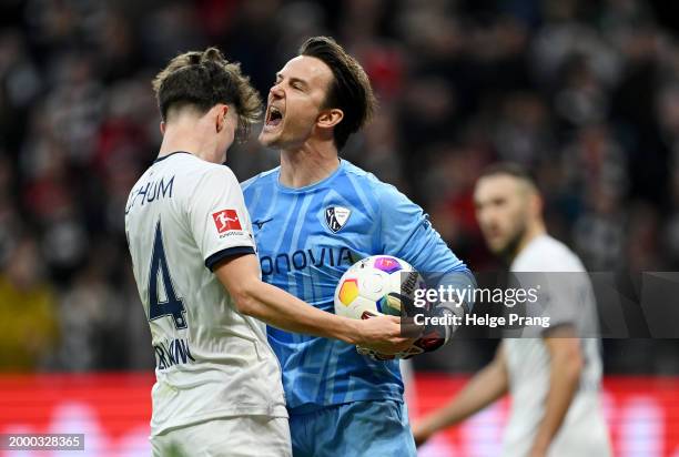 Tim Oermann of VfL Bochum interacts with Manuel Riemann of VfL Bochum during the Bundesliga match between Eintracht Frankfurt and VfL Bochum 1848 at...