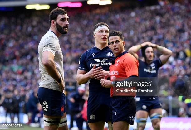Referee, Nic Berry talks to Charles Ollivon of France and Rory Darge of Scotland during the Guinness Six Nations 2024 match between Scotland and...