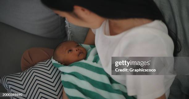 Mom Rocking Child Mother Rocking Baby To Sleep Photos and Premium High Res Pictures ...