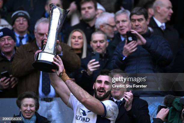 Charles Ollivon of France lifts the Auld Alliance Trophy following the team's victory during the Guinness Six Nations 2024 match between Scotland and...