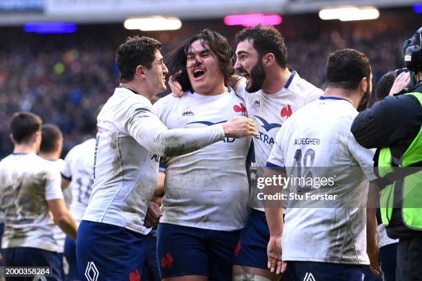 Posolo Tuilagi of celebrates with teammates following the team's victory during the Guinness Six Nations 2024 match between Scotland and France at BT...