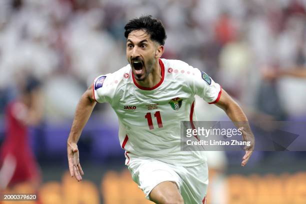 Yazan Al-Naimat of Jordan celebrates scoring his team's first goal during the AFC Asian Cup final match between Jordan and Qatar at Lusail Stadium on...