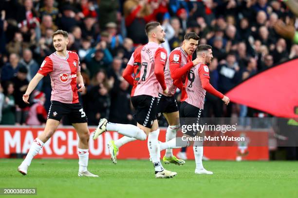 Joe Rothwell of Southampton celebrates with team mate Jan Bednarek after scoring during the Sky Bet Championship match between Southampton FC and...