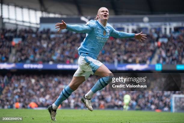 Erling Haaland of Manchester City celebrates scoring his team's first goal during the Premier League match between Manchester City and Everton FC at...