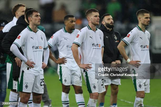 Joe Scally, Nico Elvedi and Julian Weigl of Moenchengladbach look dejected after the Bundesliga match between Borussia Mönchengladbach and SV...