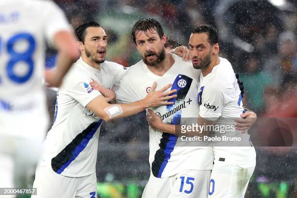 Francesco Acerbi of FC Internazionale celebrates scoring his team's first goal with teammates Hakan Calhanoglu and Matteo Darmian during the Serie A...