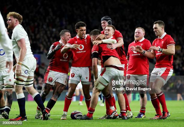 Alex Mann of Wales celebrates with teammates after scoring his team's second try during the Guinness Six Nations 2024 match between England and Wales...