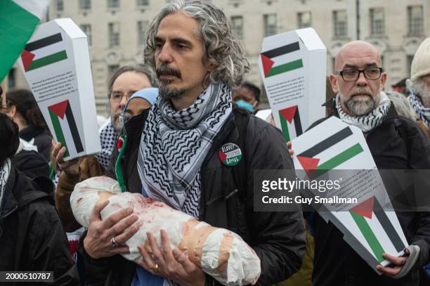 Health Workers for Palestine march from St Thomas' Hospital to a rally at Downing street in support of health care professionals in Gaza on February...